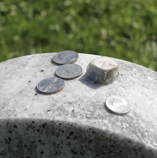 Why Do Some People Place Coins on Gravestones?