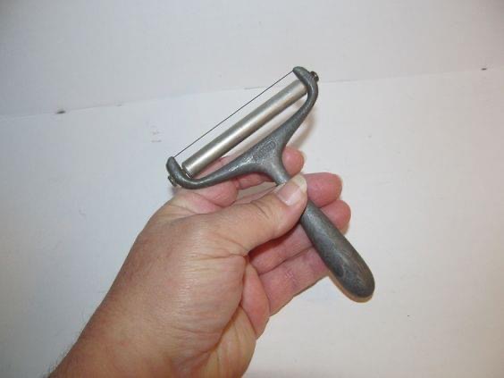 The Mysterious Vintage Cheese Slicer: A Kitchen Time Capsule